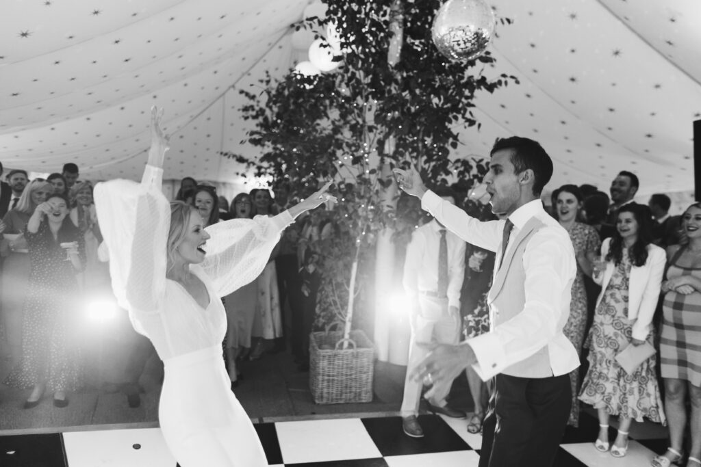 Black and white shot of the couple dancing during their south west wedding venue called Hatch House