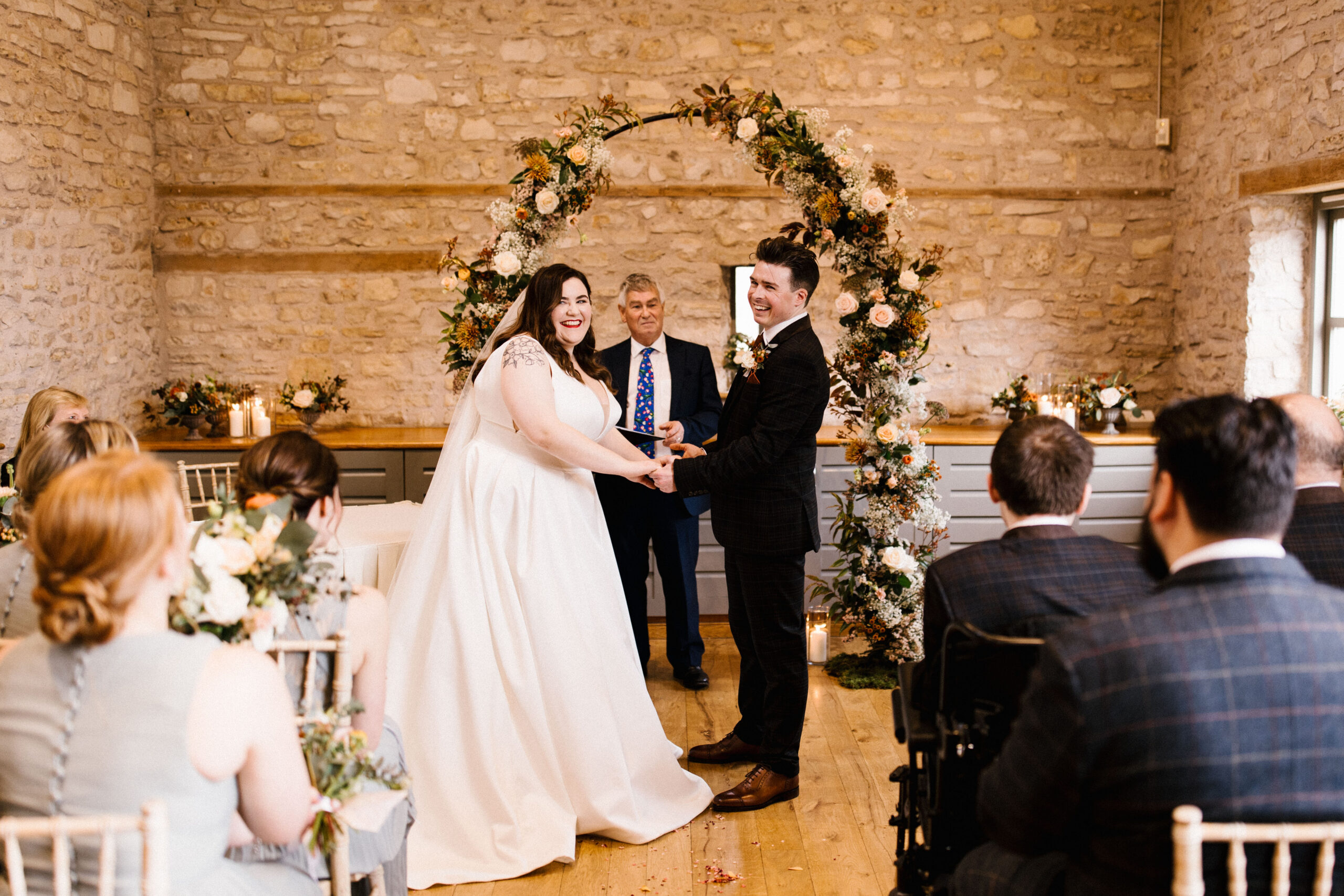 Couple during ceremony at Barn wedding venue called Folly Farm