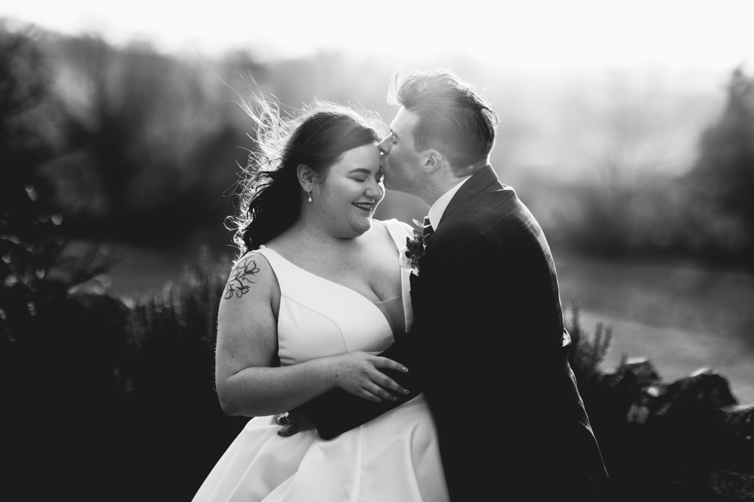 Black and white outdoor couple shot at Barn wedding venue called Folly Farm