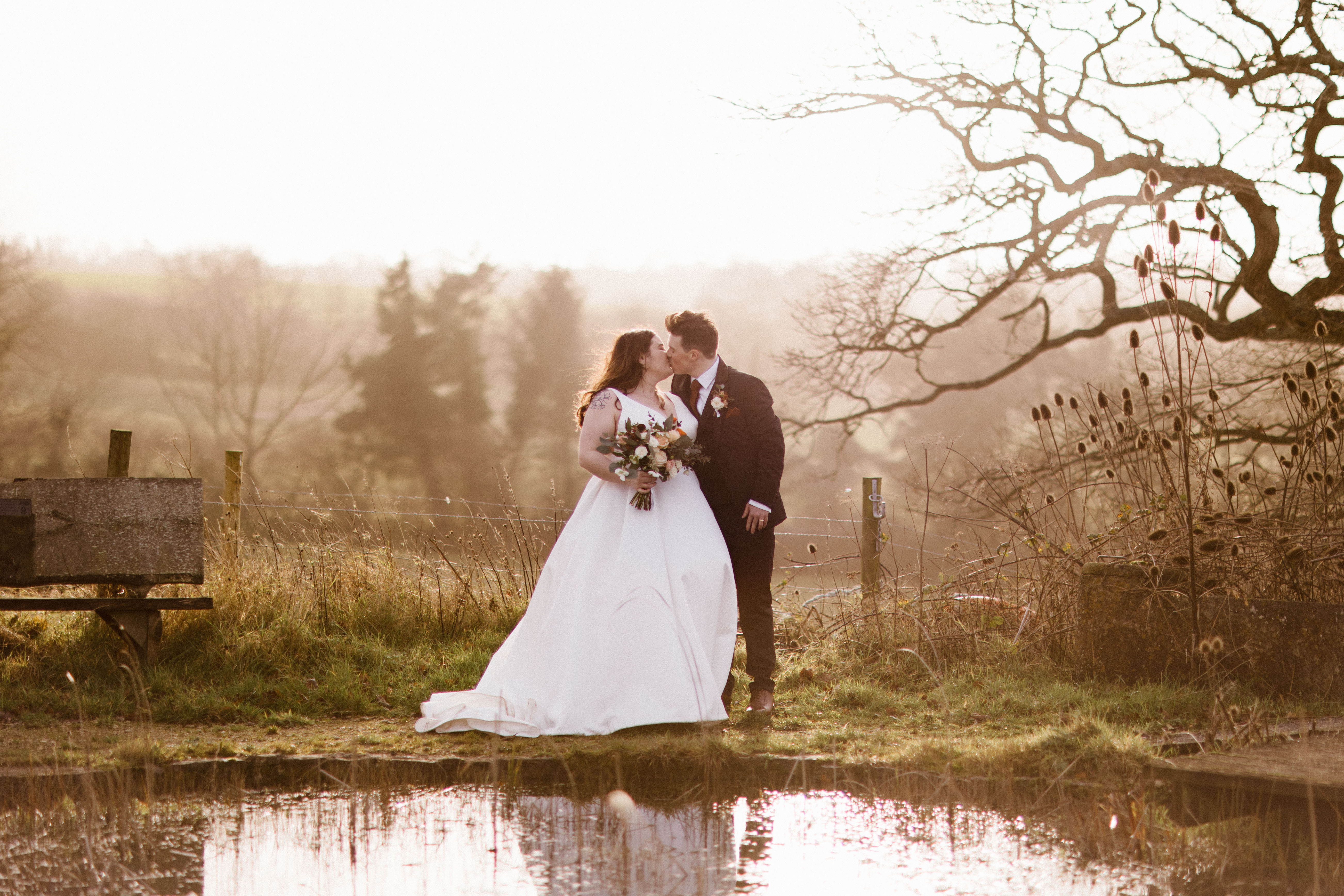 Outdoor couple shot at Barn wedding venue called Folly Farm
