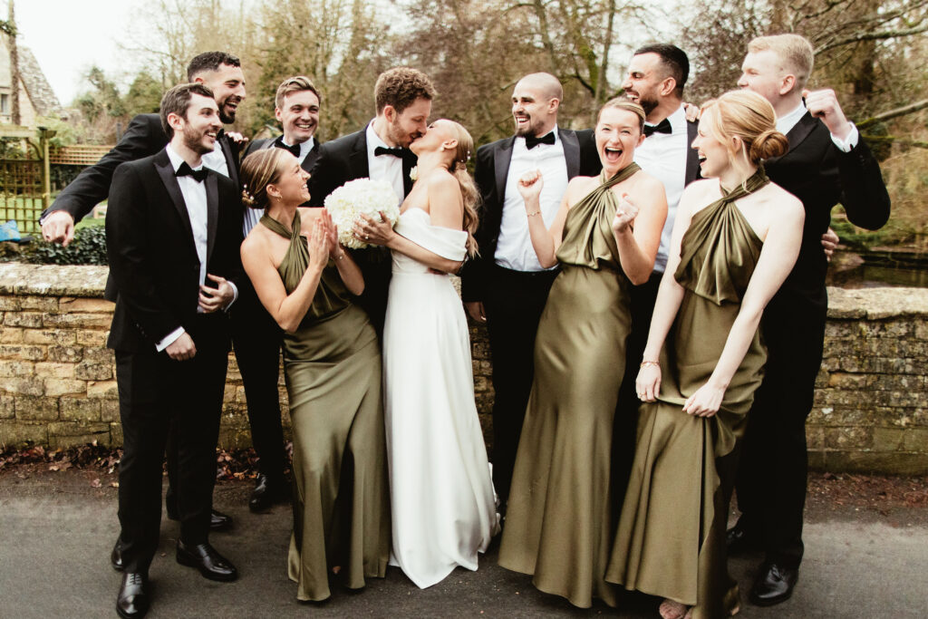 Couple and their guests group photo at their barn wedding venue called Wild Thyme and Honey