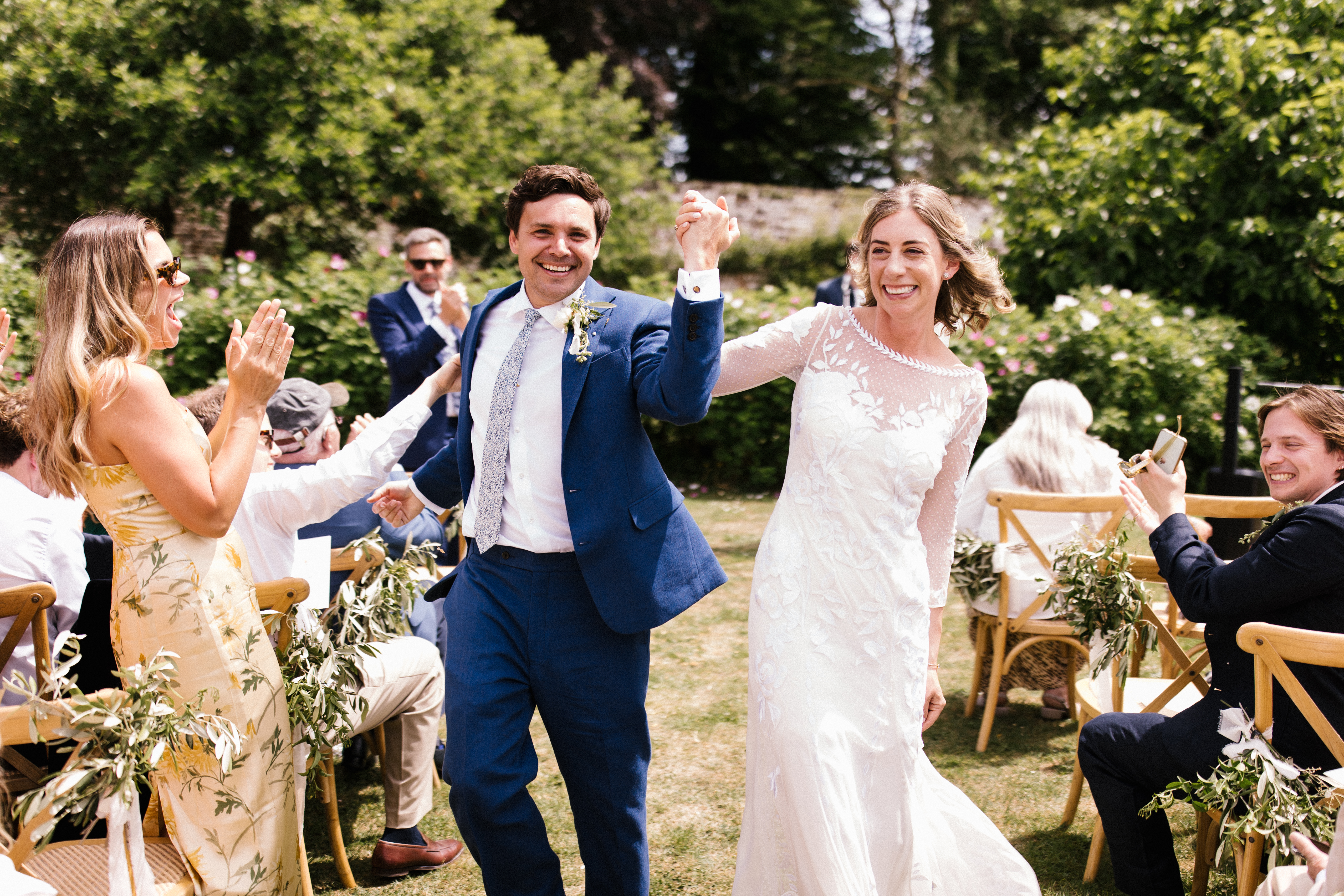 Couple during their outdoor wedding ceremony at their South west wedding venue at Pythouse Kitchen Garden