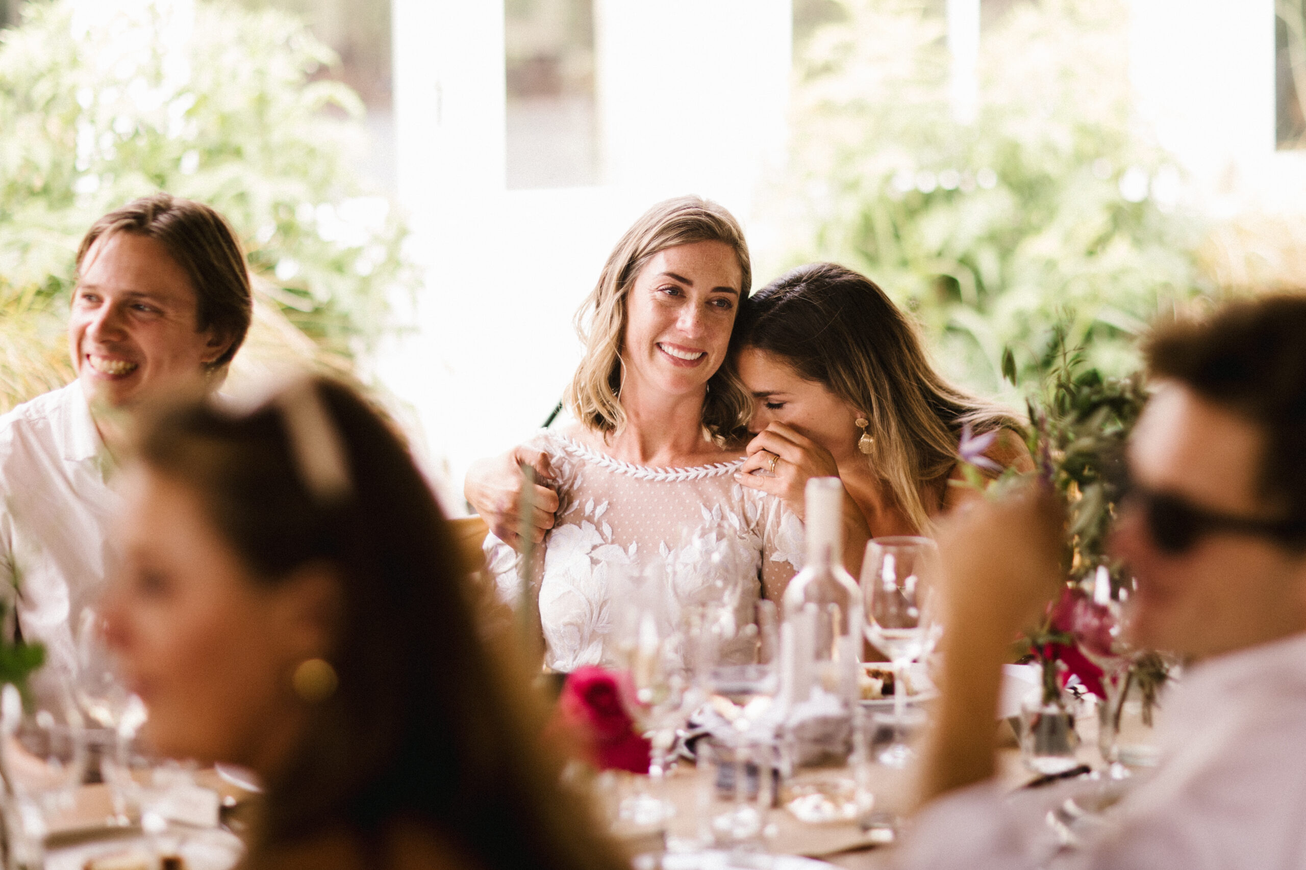 Bride and guests during speeches at their South west wedding venue at Pythouse Kitchen Garden
